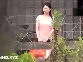 Japanese homemaker receives oral pleasure outdoors while her husband remains indoors