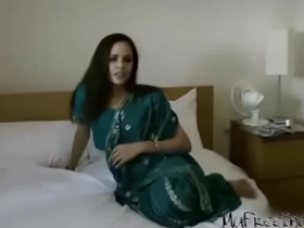 Seductive Indian mature woman in a sari enjoys sensual Hindi audio intimacy